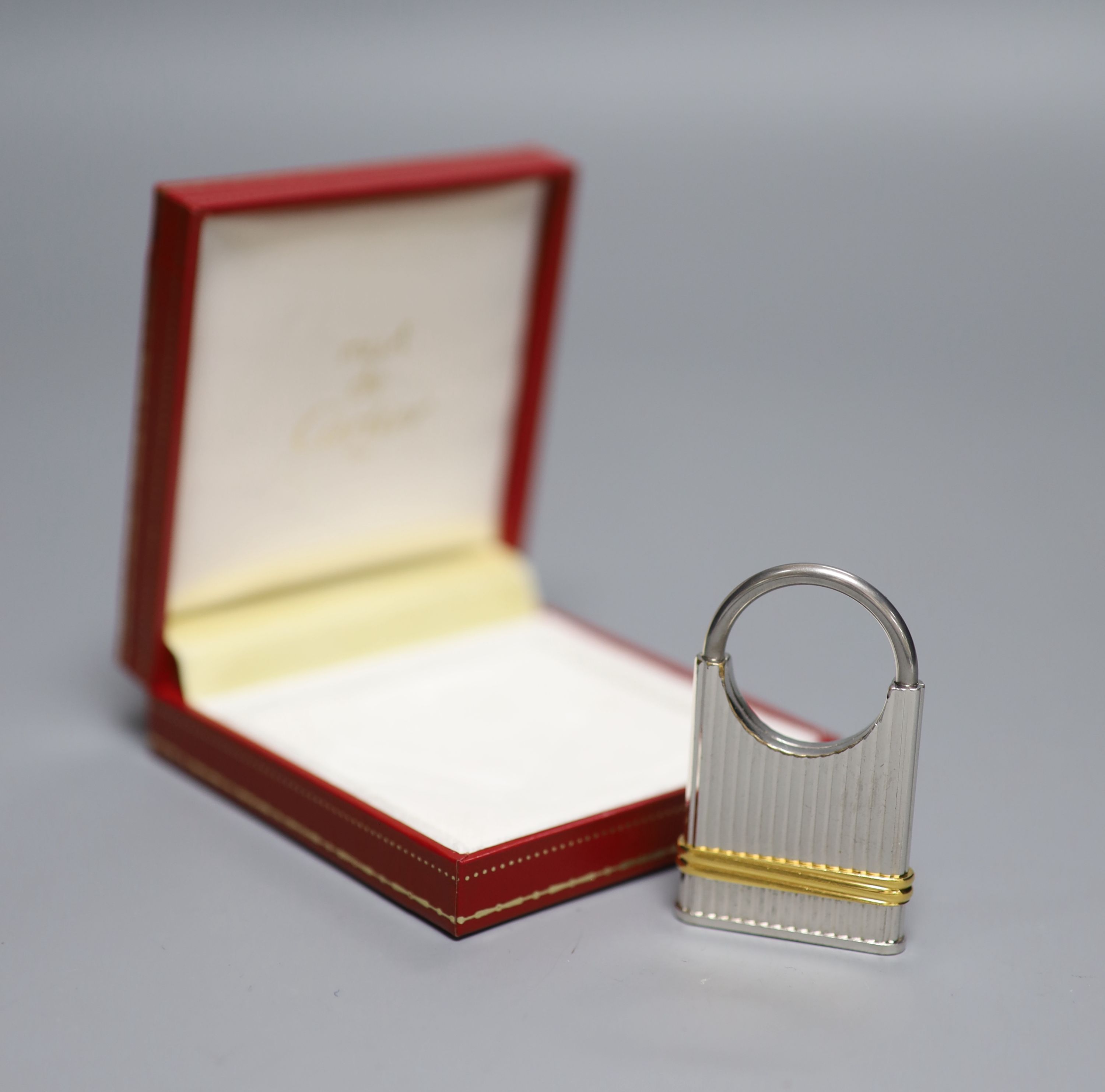 A steel and yellow metal Must de Cartier key fob, 52mm, with Cartier box.